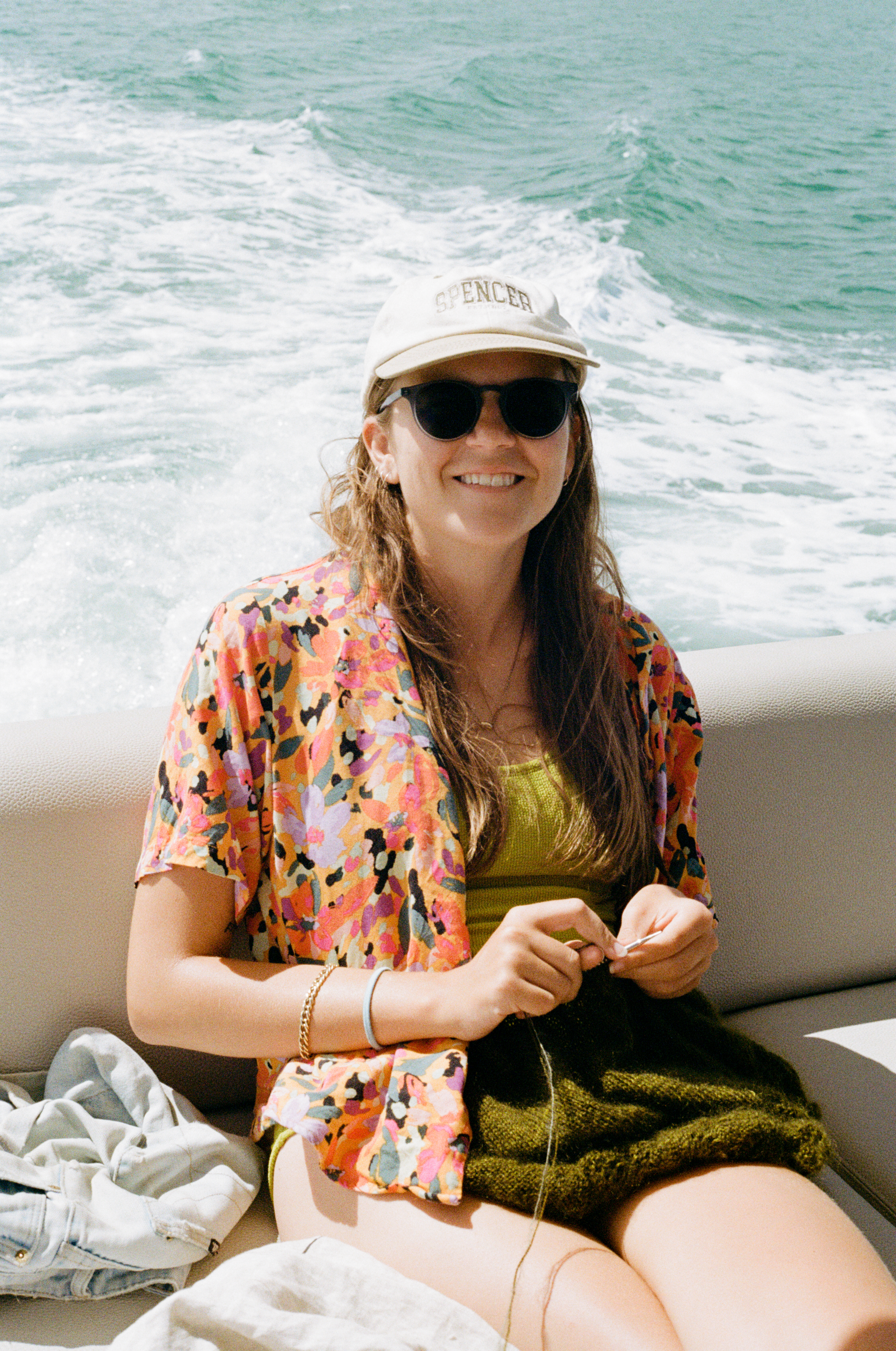 Woman knitting on a boat in Sydney